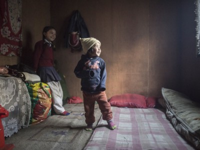 Sami Baraili, and Purnima Baraili, 7 inside the emergency relief home that was given to them by the Himalayan Trust after their home was destroyed by the 2015 earthquakes, in Thulo Gumela, Nepal. Picture taken on February 22, 2016. The Himalayan Trust funded the construction of 25 relief houses in the Solukhumbu district after the 2015 earthquakes.