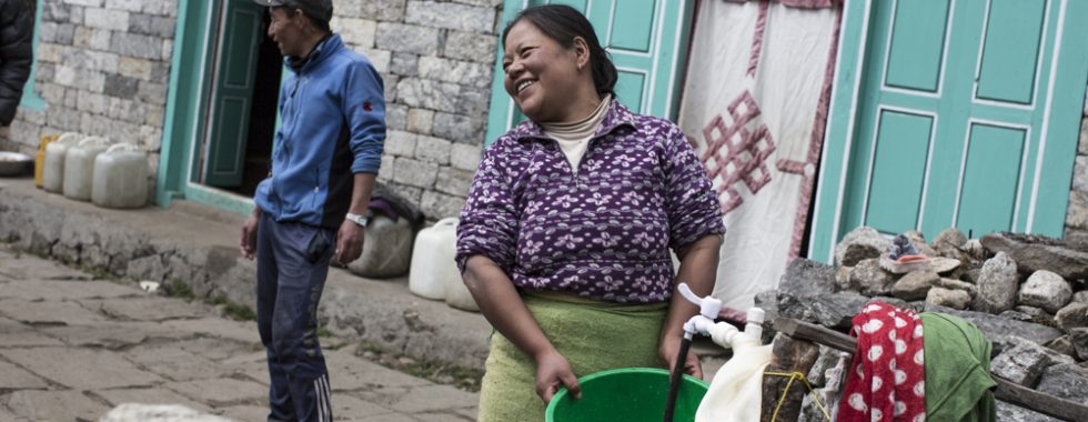 Padam Maya Rai washes clothes outside her home in Lukla.